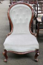 A Victorian Mahogany Spoon Back Nursing Chair, with button upholstery and scroll supports