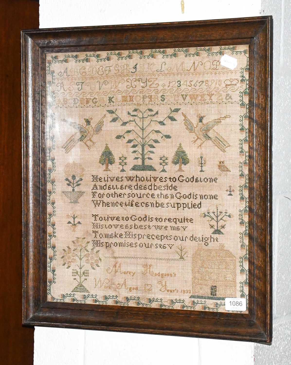 Alphabet Sampler worked by Mercy Hodgson, aged 12 dated 1833, with central verse flanked by birds,
