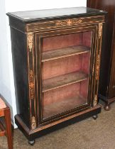 A Victorian Ebonised and Inlaid Pier Cabinet, glazed door, shelved interior, elaborate gilt-metal