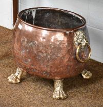 A Victorian Brass Mounted Copper Log Bin, with lion mask handles and on paw feet, 54cm wide Slight