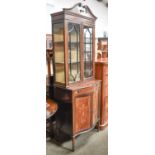 An Edwardian Inlaid Mahogany and Serpentine Fronted Display Cabinet, with swan neck pediment, glazed