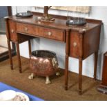 A Regency Style Breakfront Mahogany Sideboard, with reeded top and on ring turned supports, 146cm by