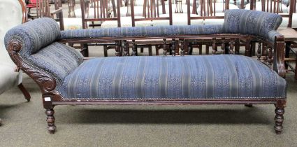 An Edwardian Carved Mahogany Chaise Longue, with striped damask upholstery, approximatley 179cm by