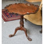 A 19th Century Carved Mahogany Tripod Table, with shaped shell carved top on ball and claw feet,