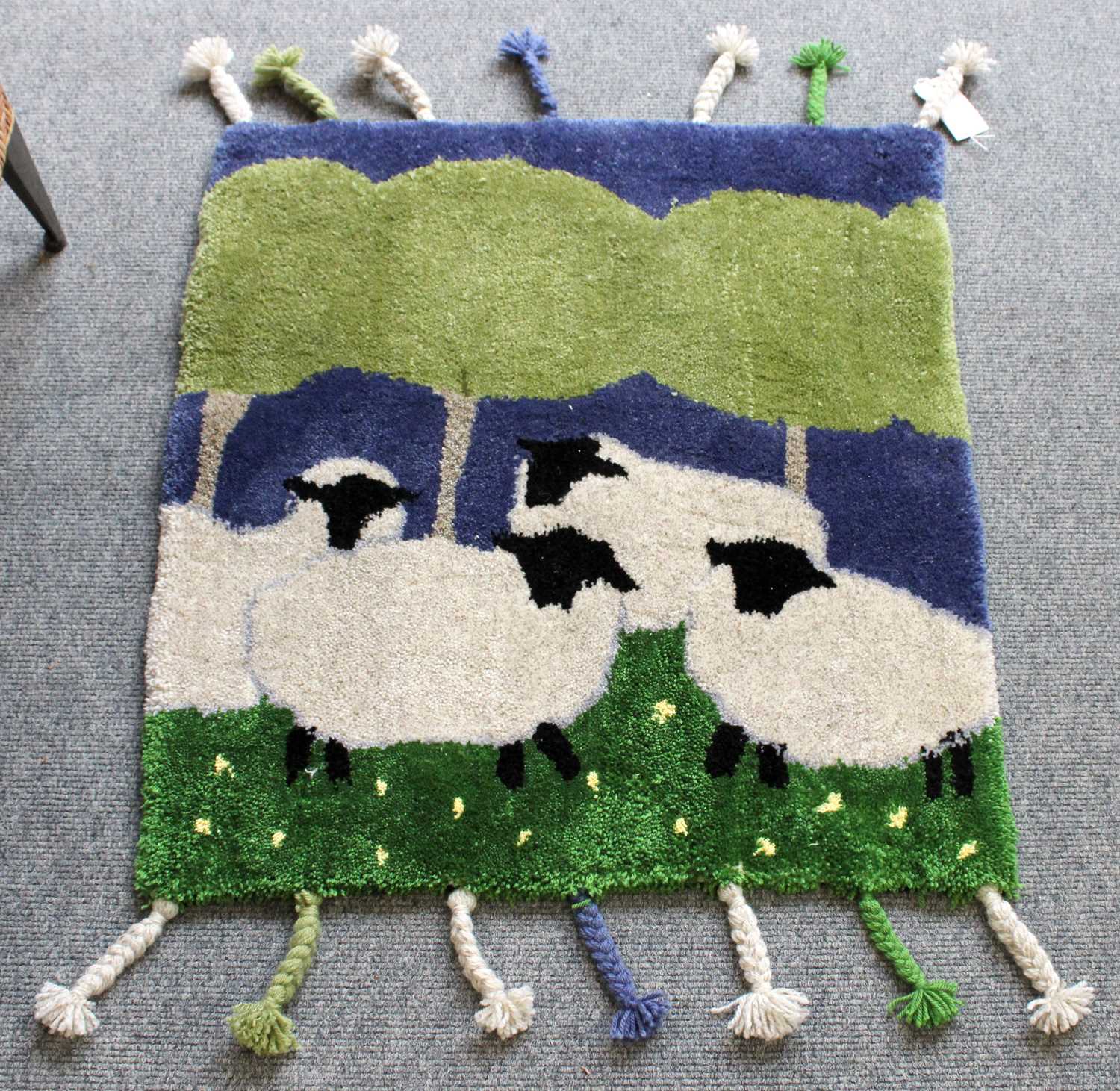 Handmade Jane Dobinson "Bramble & Bumble" Rug, the field depicting sheep grazing in a meadow beneath