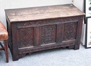 An 18th Century Oak Coffer, dated 1726 and carved with foliage and lozenges, 96cm by 41cm by 56cm