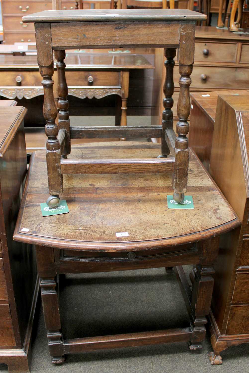 A 19th Century Continental Walnut Centre Table, with bowed sides, single double action drawer and on - Image 2 of 3