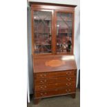 An Edwardian Mahogany and Satinwood-Crossbanded Bureau Bookcase, the moulded cornice above twin