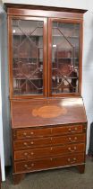 An Edwardian Mahogany and Satinwood-Crossbanded Bureau Bookcase, the moulded cornice above twin