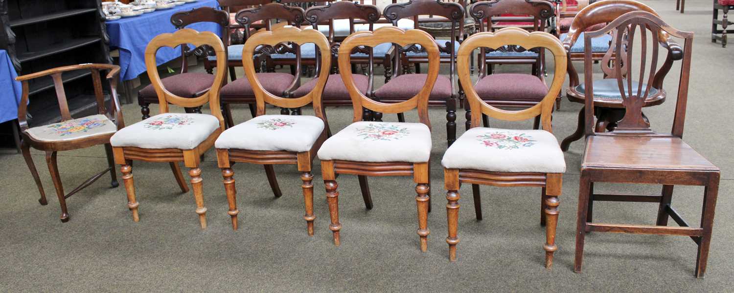 A Set of Four Victorian Mahogany Balloon Back Dining Chairs, with needle point upholstery;