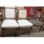 A Pair of Holland & Sons Carved Oak Side Chairs, part upholstered on turned supports and