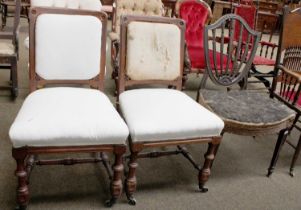A Pair of Holland & Sons Carved Oak Side Chairs, part upholstered on turned supports and