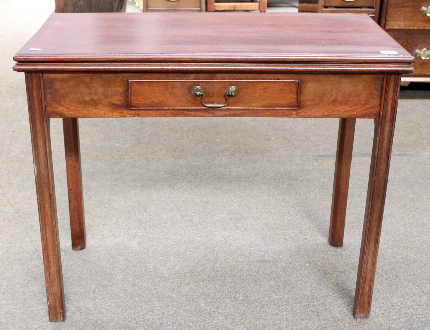 A George III Mahogany Fold Over Tea Table (repolised) with single drawer and on reeded square