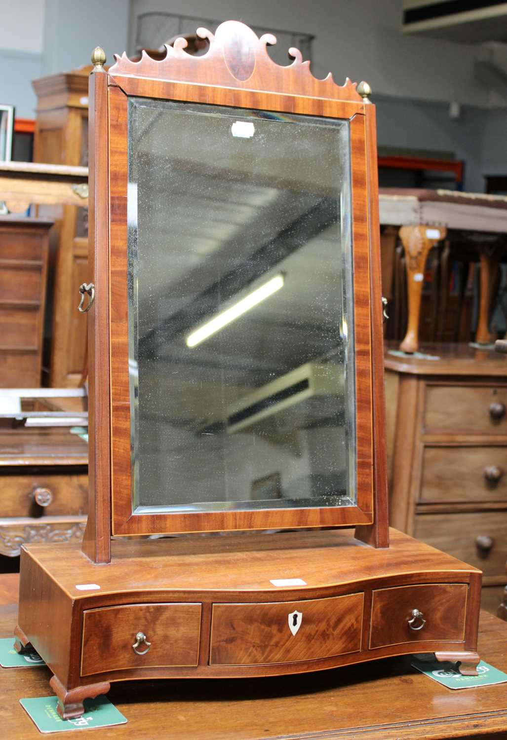 A Regency Mahogany Dressing Table Mirror, with strung inlay and three drawer serpentine base, bone