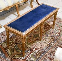 A Carved Giltwood Long Stool, constructed with 19th century elements, having a floral frieze on