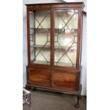 An Edwardian Mahogany Glazed Display Cabinet, moulded cornice over twin astrgal glazed doors, twin