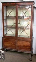 An Edwardian Mahogany Glazed Display Cabinet, moulded cornice over twin astrgal glazed doors, twin