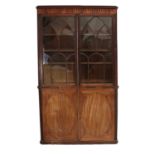 A Mahogany Bookcase, composed of 19th century elements, 135cm by 38cm by 237cm