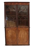 A Mahogany Bookcase, composed of 19th century elements, 135cm by 38cm by 237cm