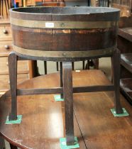 A Staived Oak Planter on Stand, early 20th century, makers R.A.Lister & Co, with metal liner, 59cm