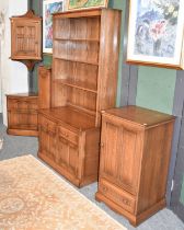 A Group of Ercol Elm Furniture: comprising bookcase cabinet, 98cm, by 48cm by 197cm, single doorn