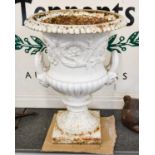 A 19th Century White Painted Cast Iron Campana Urn, twin-handled and part gadrooned, cast with