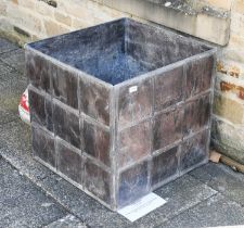 A Large Lead Garden Planter, of square form, 60cm by 60cm by 60cm Very slightly mis shapen, numerous