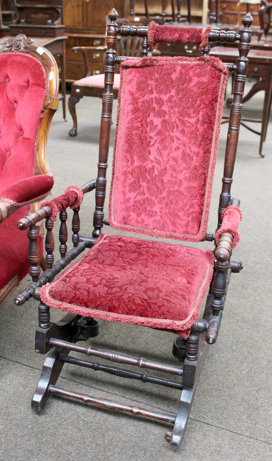 An American Rocking Chair, early 20th century, with typical turned frame and part upholstered