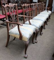A Set of Six George III Style Dining Chairs, with carved scrolling cresting rails, pierced splats,