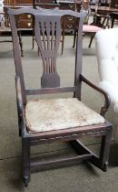 A George III Mahogany Rocking Armchair, with yoke shaped cresting rail and pierced splat