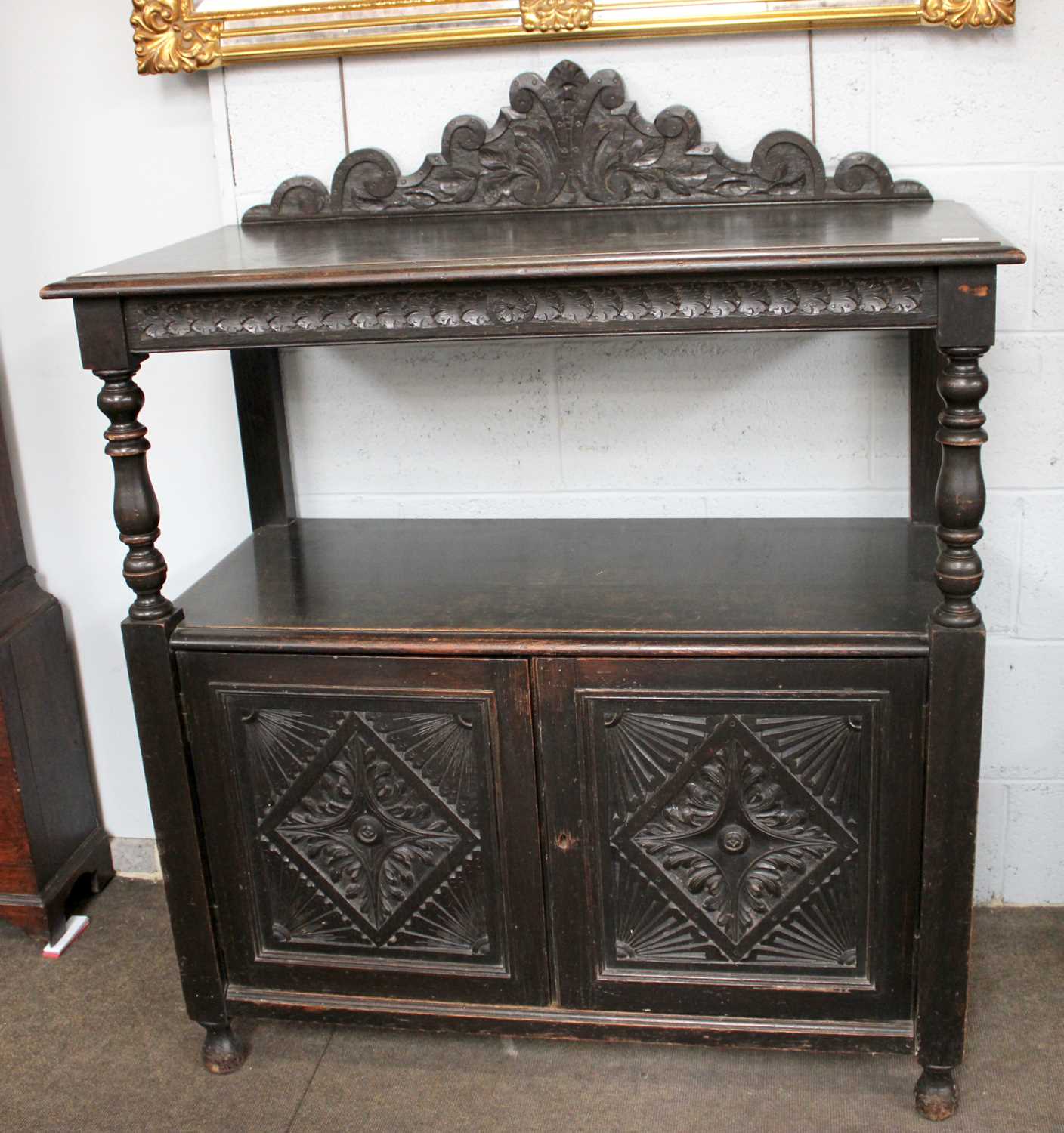 An 18th Century Style Oak Buffet, shaped scrollwork pediment over two tiers, turned column supports,