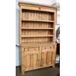 A Victorian Pine Dresser and Rack, 138cm by 46cm by 224cm