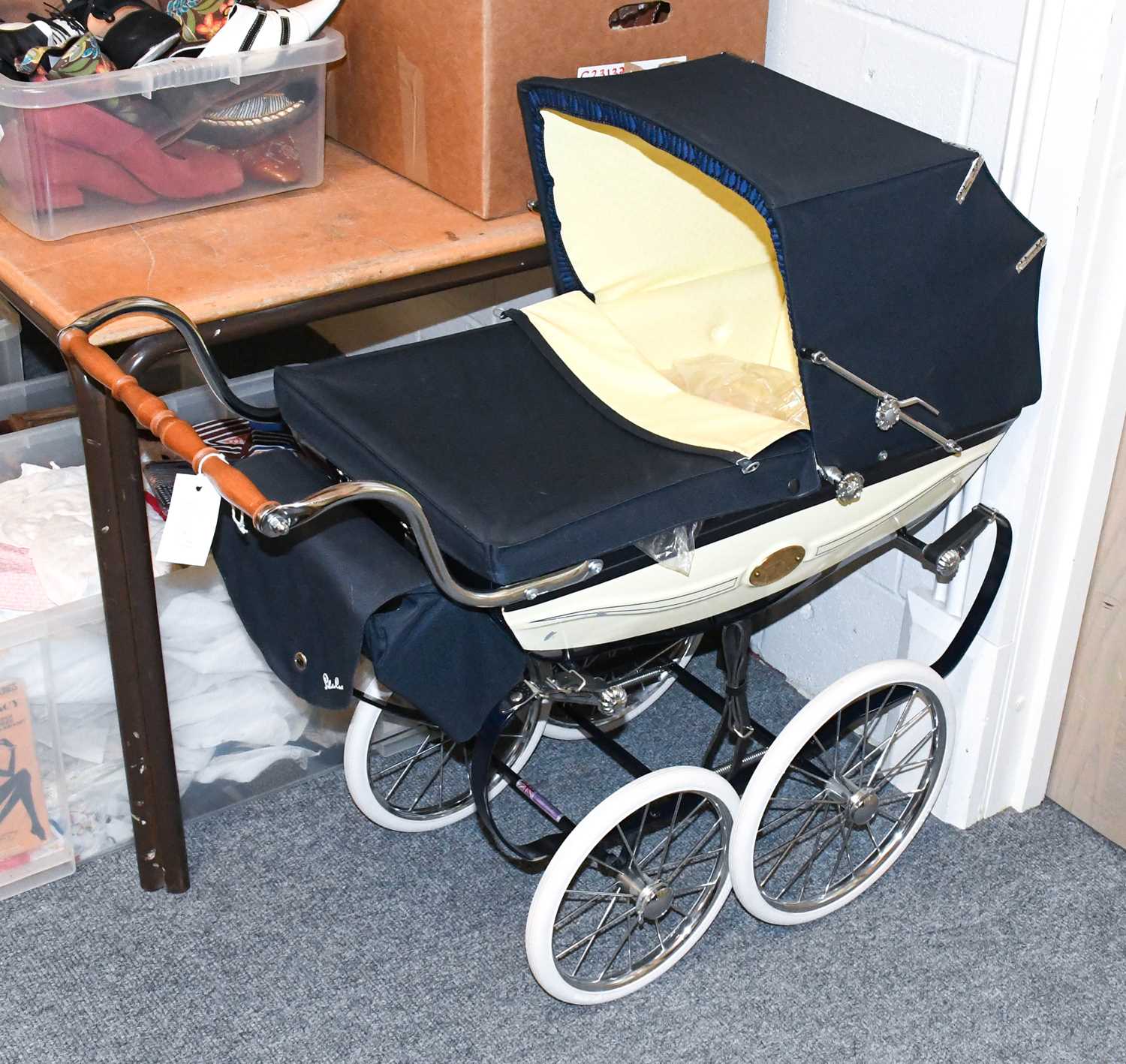 A Silver Cross "Millennium" Pram, numbered 0146, with pale yellow silk-type insert cushion and quilt