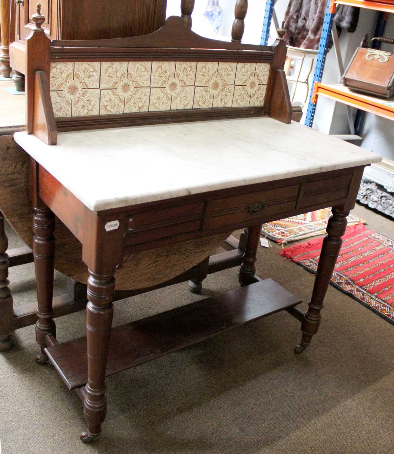 A Victorian Mahogany Marble-Topped Washtand, with tiled back, single drawer, turned legs to - Image 2 of 3