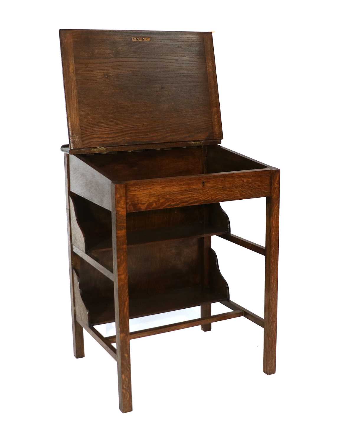 A Small Oak Clerks Desk, with two undershelves and on square supports, 64cm by 54cm by 83cm