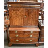 A Walnut Secretaire Chest, first half of the 18th century, with a fitted cabinet to the top having