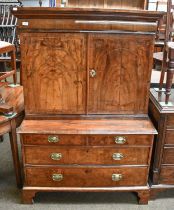 A Walnut Secretaire Chest, first half of the 18th century, with a fitted cabinet to the top having