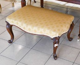 A 19th Century Rosewood Foot Stool, the shaped top raised on leaf-carved cabriole legs, 80cm by 56cm
