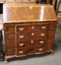 A George III Walnut & Mahogany Breakfront Bureau, the fall-flap opening to reveal elaborate fitted