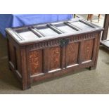 An 18th Century Oak Four Panel Coffer, with carved frieze and original clasp, 117cm by 55cm by 62cm