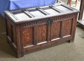 An 18th Century Oak Four Panel Coffer, with carved frieze and original clasp, 117cm by 55cm by 62cm