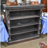 A Carved Oak Open Bookcase, circa 1900, carved with patara to the frieze and with fruit foliage