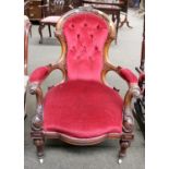 A Victorian Carved Walnut Spoon Back Nursing Chair, with buttoned upholstery and on pot castors