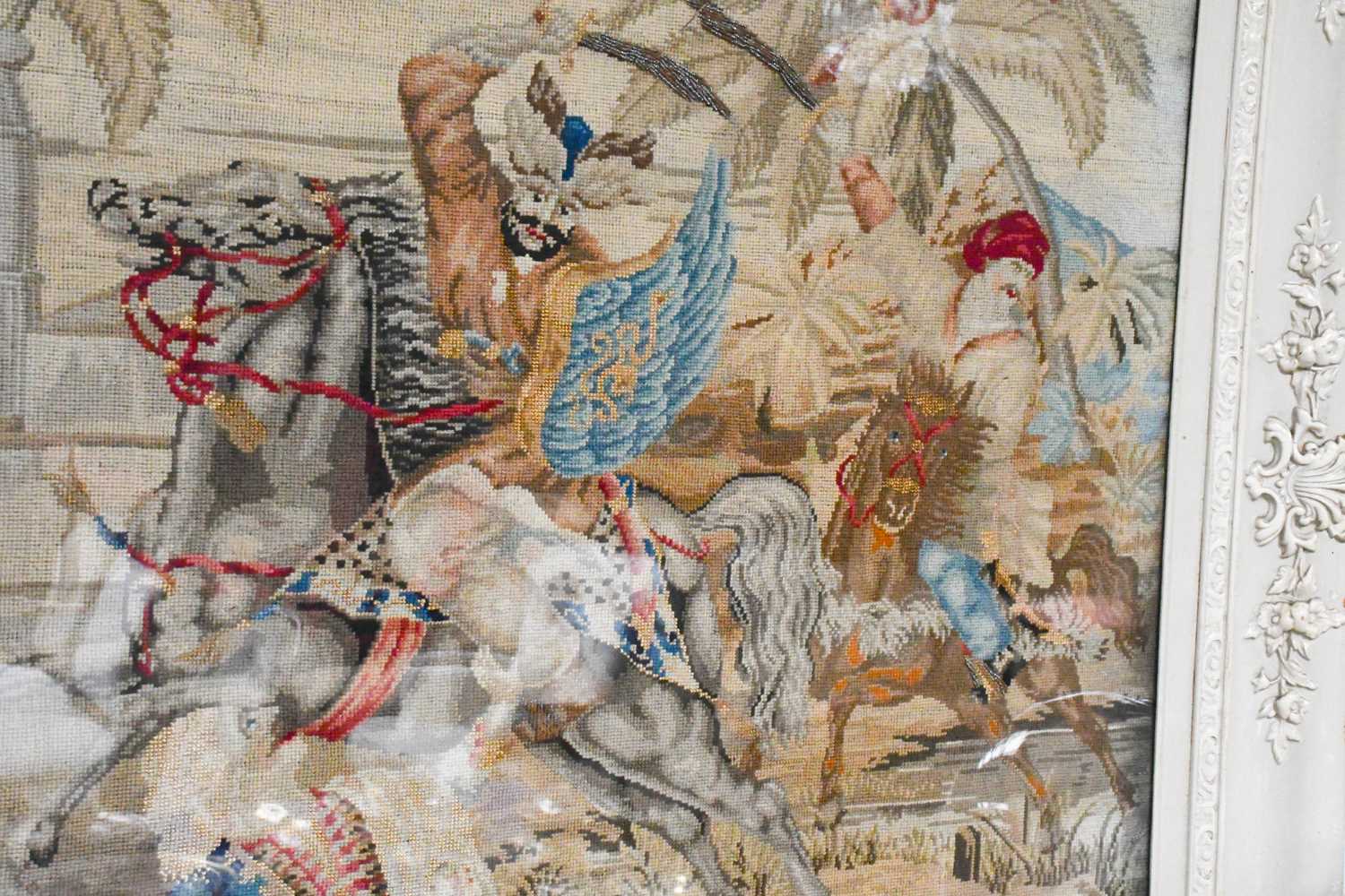 A Victorian Needlework Panel, depicting Indian figures on horseback, 86cm by 81cm not including - Image 2 of 2