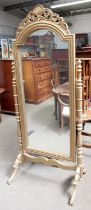 A Cheval Mirror, on turned supports, later gilt painted, 193cm