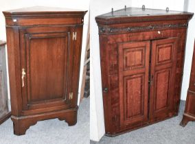 An 18th Century Inlaid and Cross-banded Oak and Mahogany Hanging Corner Cupboard, with carved frieze