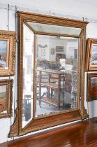 A 19th Century Gilt Framed Sectional Overmantel Mirror, of cushion form, 134cm by 140cm