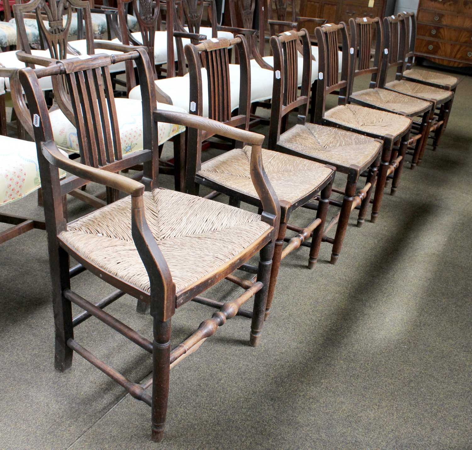 A Set of Seven Early 19th Century Rail Back Chairs, with rush seats, including one carver. - Image 2 of 2