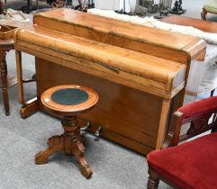 A 1920s B. Squire Walnut Cased Minx Miniature Piano, 131cm by 53cm by 88cm, together with a