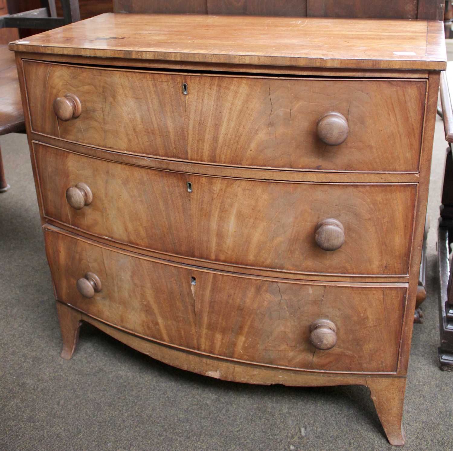 An Early 19th Century Mahogany and Crossbanded Bowfront Chest of Three Drawers, 90cm by 93cm by